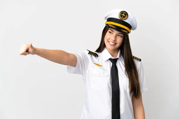 巴西女飞行员在孤立的白色背景下举起大拇指做了个手势 — 图库照片