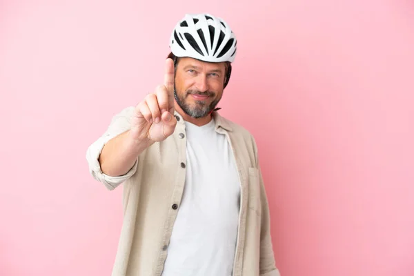 Senior Dutch Man Bike Helmet Isolated Pink Background Showing Lifting — Stock Photo, Image