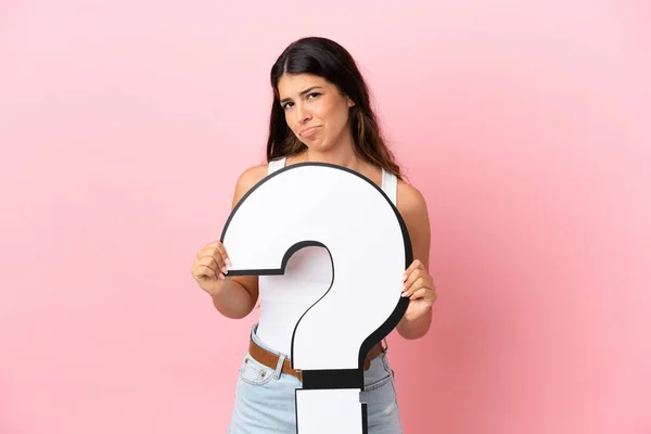 Young Caucasian Woman Isolated Pink Background Holding Question Mark Icon — Stock Photo, Image
