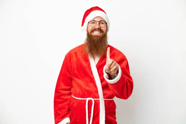 Reddish Άνθρωπος Μεταμφιεσμένος Santa Claus Απομονώνονται Λευκό Δείχνει Και Σηκώνοντας — Φωτογραφία Αρχείου