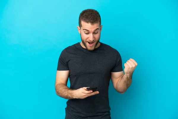 Young Handsome Caucasian Man Isolated Blue Background Surprised Sending Message — Stock Photo, Image