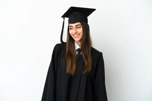 Giovane Laureato Isolato Sfondo Bianco Guardando Lato Sorridendo — Foto Stock