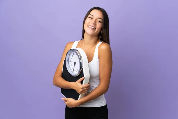 Teenager Girl Isolated Purple Background Weighing Machine — Stock Photo, Image