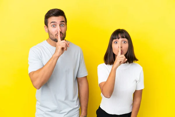 Young Couple Isolated Yellow Background Showing Sign Silence Gesture Putting — Stock Photo, Image