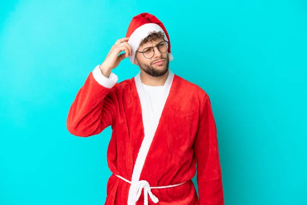 Young Man Disguised Santa Claus Isolated Blue Background Having Doubts — Stock Photo, Image