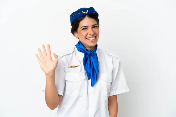 비행기 스튜워트 표정으로 손으로 경례를 배경에서 고립된 카시아 여인을 경고하였다 — 스톡 사진