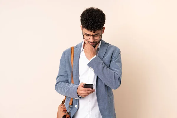 Young Business Moroccan Man Isolated Beige Background Thinking Sending Message — 图库照片