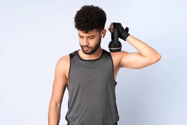 Young Moroccan Man Isolated Blue Background Making Weightlifting Kettlebell — Stock Photo, Image
