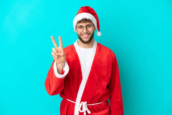 Young Man Disguised Santa Claus Isolated Blue Background Smiling Showing — Stock Photo, Image