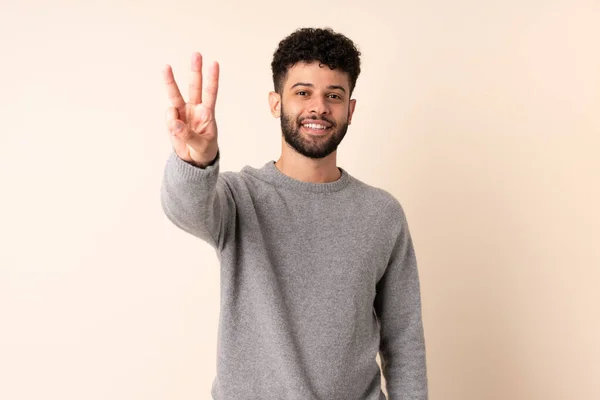 Young Moroccan Man Isolated Beige Background Happy Counting Three Fingers — Stock Photo, Image