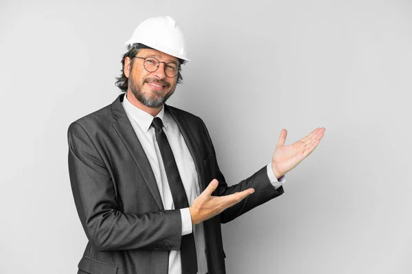 Young Architect Man Helmet Isolated Background Extending Hands Side Inviting — Stock Photo, Image