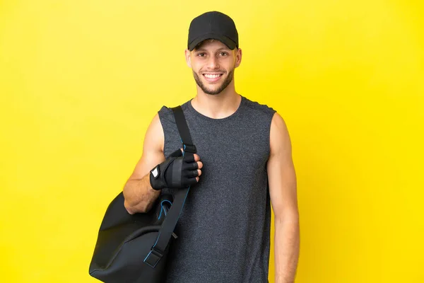 Young Sport Blonde Man Sport Bag Isolated Yellow Background Laughing — 图库照片