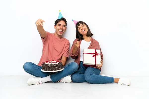 Young Mixed Race Couple Celebrating Birthday Sitting Floor Isolated White — Stock Photo, Image