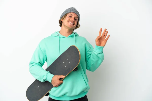 Young Skater Blonde Man Isolated White Background Saluting Hand Happy — Stock Photo, Image
