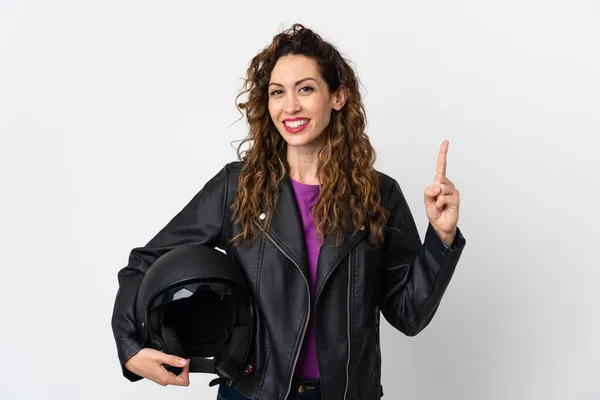 若いですCaucasian女性を保持していますオートバイヘルメットショーと持ち上げる指で最高の兆候 — ストック写真