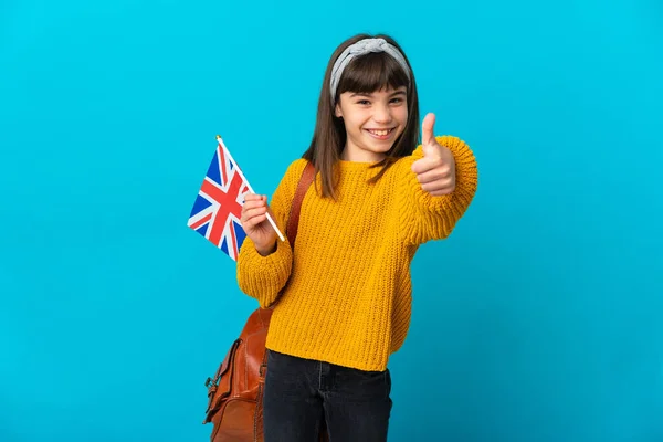Mała Dziewczynka Studiuje Angielski Niebieskim Tle Kciukami Górze Stało Się — Zdjęcie stockowe