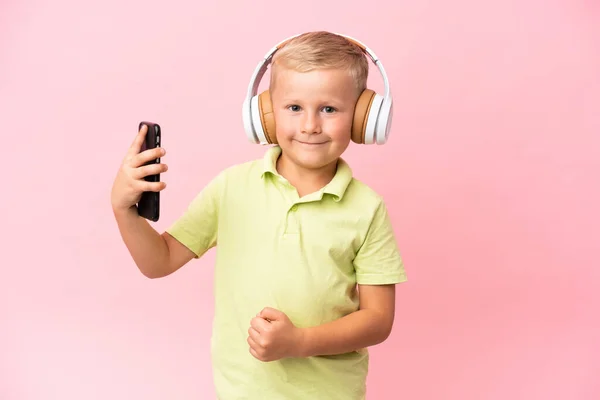 Little Russian Boy Isolated Pink Background Listening Music Dancing — 图库照片