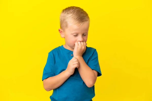 Little Russian Boy Isolated Yellow Background Having Doubts — Stockfoto