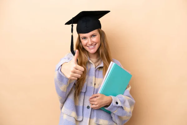 Junge Studentin Über Isolierten Hintergrund Mit Erhobenem Daumen Weil Etwas — Stockfoto