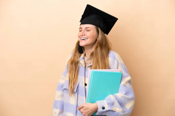Junge Studentin Mit Isoliertem Hintergrund Lacht Seitenlage — Stockfoto