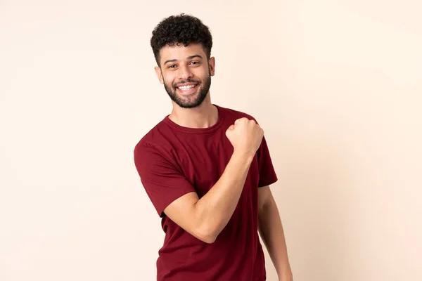 Young Moroccan Man Isolated Beige Background Celebrating Victory — Stock Photo, Image