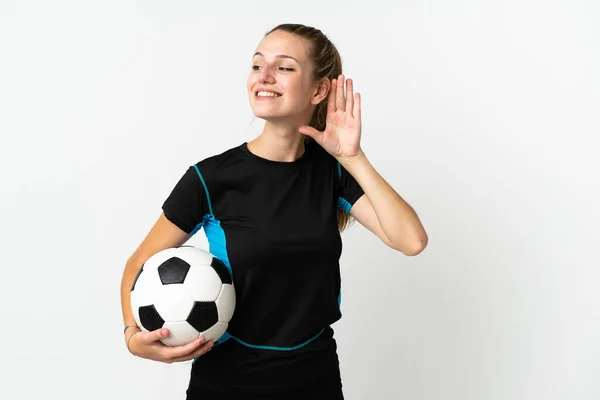 Joven Futbolista Mujer Aislada Sobre Fondo Blanco Escuchando Algo Poniendo —  Fotos de Stock