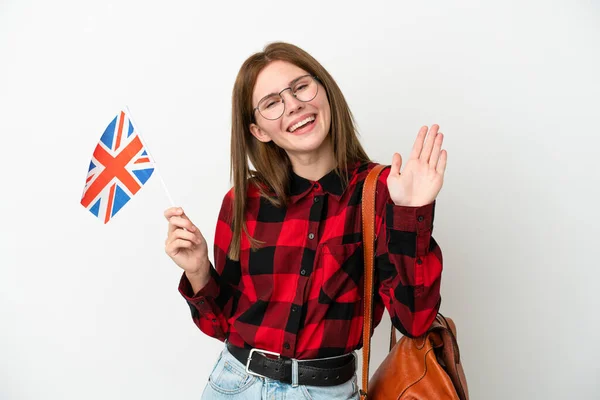 Mladá Žena Drží Vlajku Spojeného Království Izolované Modrém Pozadí Salutování — Stock fotografie
