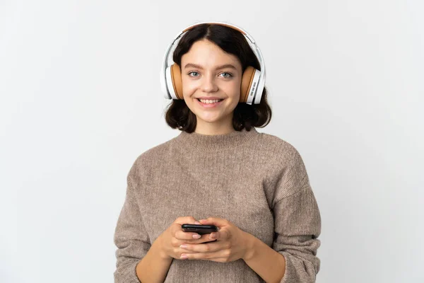 Adolescente Ucraniana Chica Aislada Fondo Blanco Escuchando Música Con Móvil — Foto de Stock