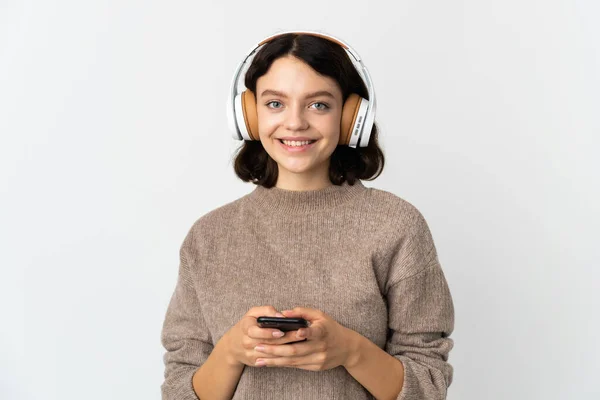 Teenager Ukrajinská Dívka Izolované Bílém Pozadí Poslech Hudby Mobilním Pohledu — Stock fotografie