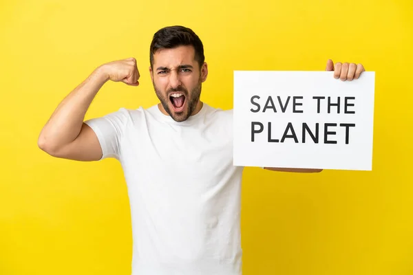 Mladý Pohledný Běloch Izolovaný Žlutém Pozadí Drží Plakát Textem Planet — Stock fotografie