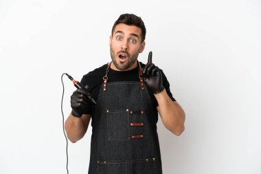 Dövme sanatçısı beyaz arka planda izole edilmiş bir şekilde parmağını kaldırırken çözümün farkına varmayı amaçlıyor