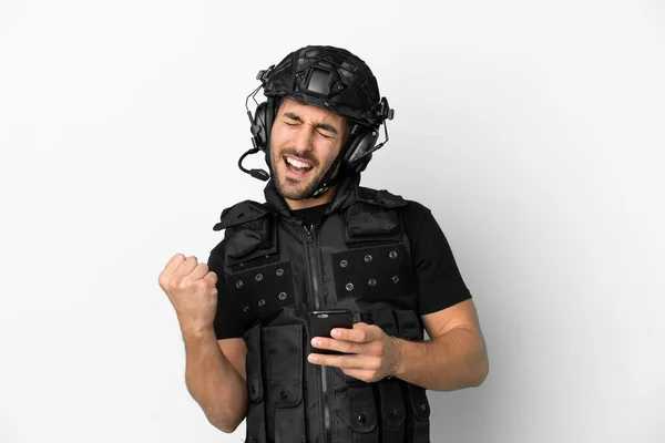 Young Caucasian Swat Isolated White Background Phone Victory Position — Stockfoto