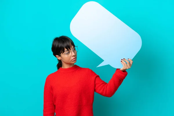 Young Woman Isolated Blue Background Holding Empty Speech Bubble Sad — Stock Photo, Image