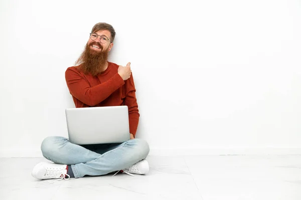 Young Reddish Caucasian Man Laptop Isolated White Background Pointing Back — Stockfoto