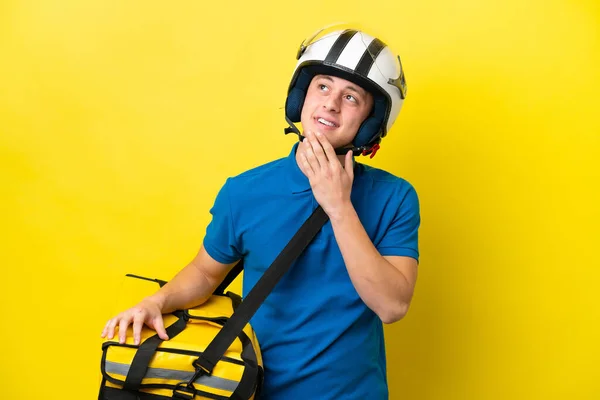 Young Brazilian Man Thermal Backpack Isolated Yellow Background Looking While — стоковое фото