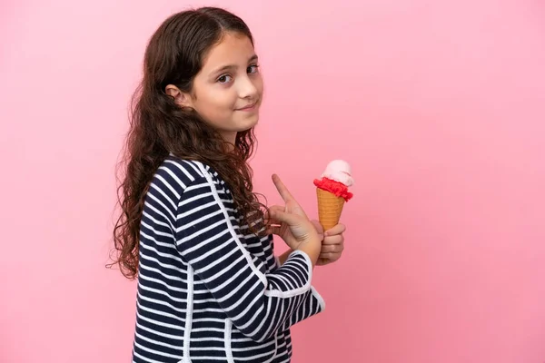 Little Caucasian Girl Holding Ice Cream Isolated Pink Background Pointing — Stockfoto