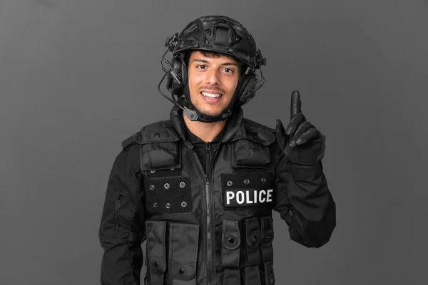 Swat Caucasian Man Isolated Grey Background Showing Lifting Finger Sign — Stockfoto
