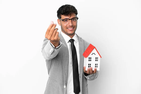 Business Man Holding House Isolated Blue Background Making Money Gesture — Stockfoto