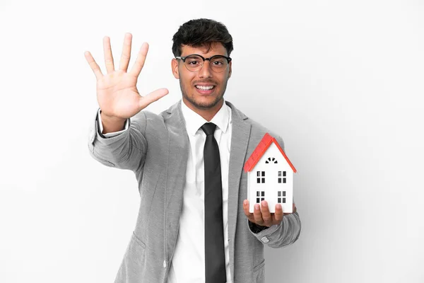 Business Man Holding House Isolated Blue Background Counting Five Fingers — Stockfoto