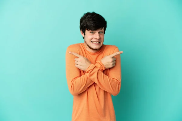 Young Russian Man Isolated Blue Background Pointing Laterals Having Doubts — 图库照片