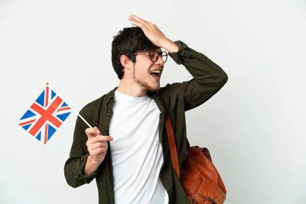 Beyaz Arka Planda Izole Edilmiş Bir Birleşik Krallık Bayrağı Taşıyan — Stok fotoğraf