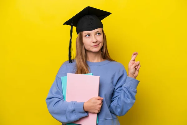 Young Student Russian Woman Isolated Yellow Background Fingers Crossing Wishing — Stock Photo, Image