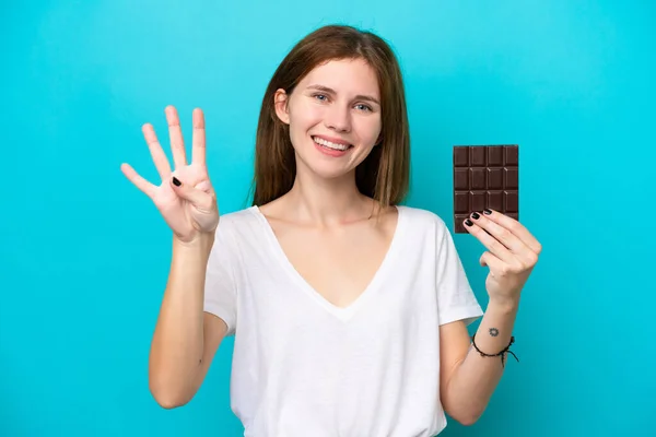 Mladá Anglická Žena Čokoládou Izolované Modrém Pozadí Šťastný Počítání Čtyři — Stock fotografie