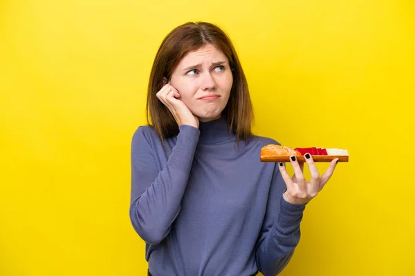 Young English Woman Holding Sashimi Isolated Yellow Background Frustrated Covering — Stockfoto