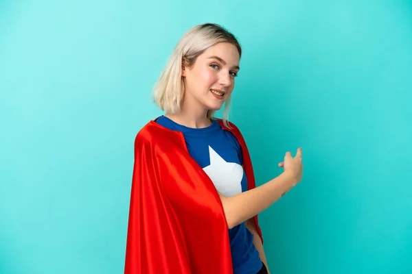 Super Hero Caucasian Woman Isolated Blue Background Pointing Back — Stock Photo, Image
