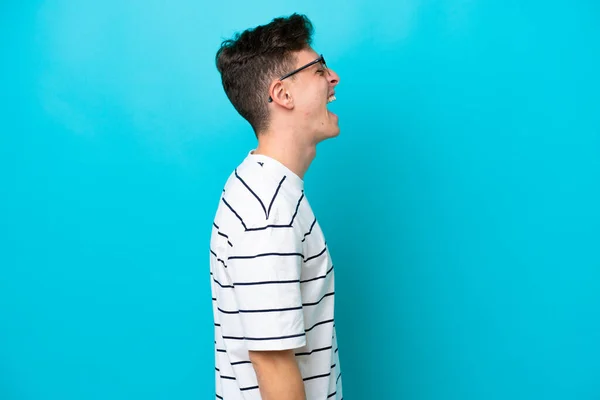 Young Handsome Brazilian Man Isolated Blue Background Laughing Lateral Position — Zdjęcie stockowe