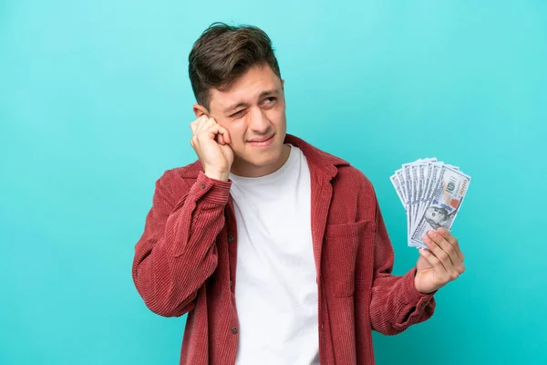 Young Brazilian Man Taking Lot Money Isolated Blue Background Frustrated — стоковое фото