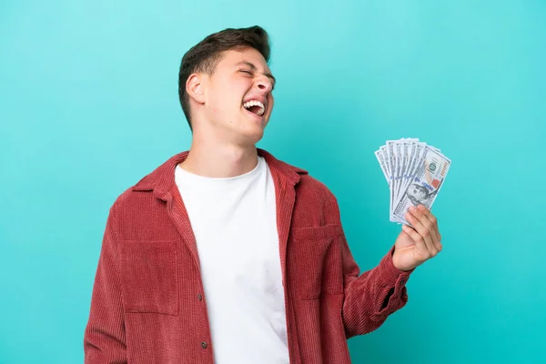 Young Brazilian Man Taking Lot Money Isolated Blue Background Laughing — Foto de Stock