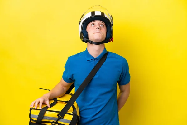 Young Brazilian Man Thermal Backpack Isolated Yellow Background Looking —  Fotos de Stock