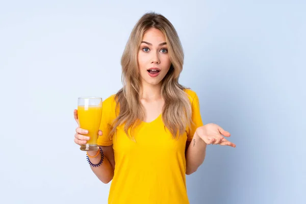 Teenager Russian Girl Holding Orange Juice Isolated Blue Background Shocked — Fotografia de Stock